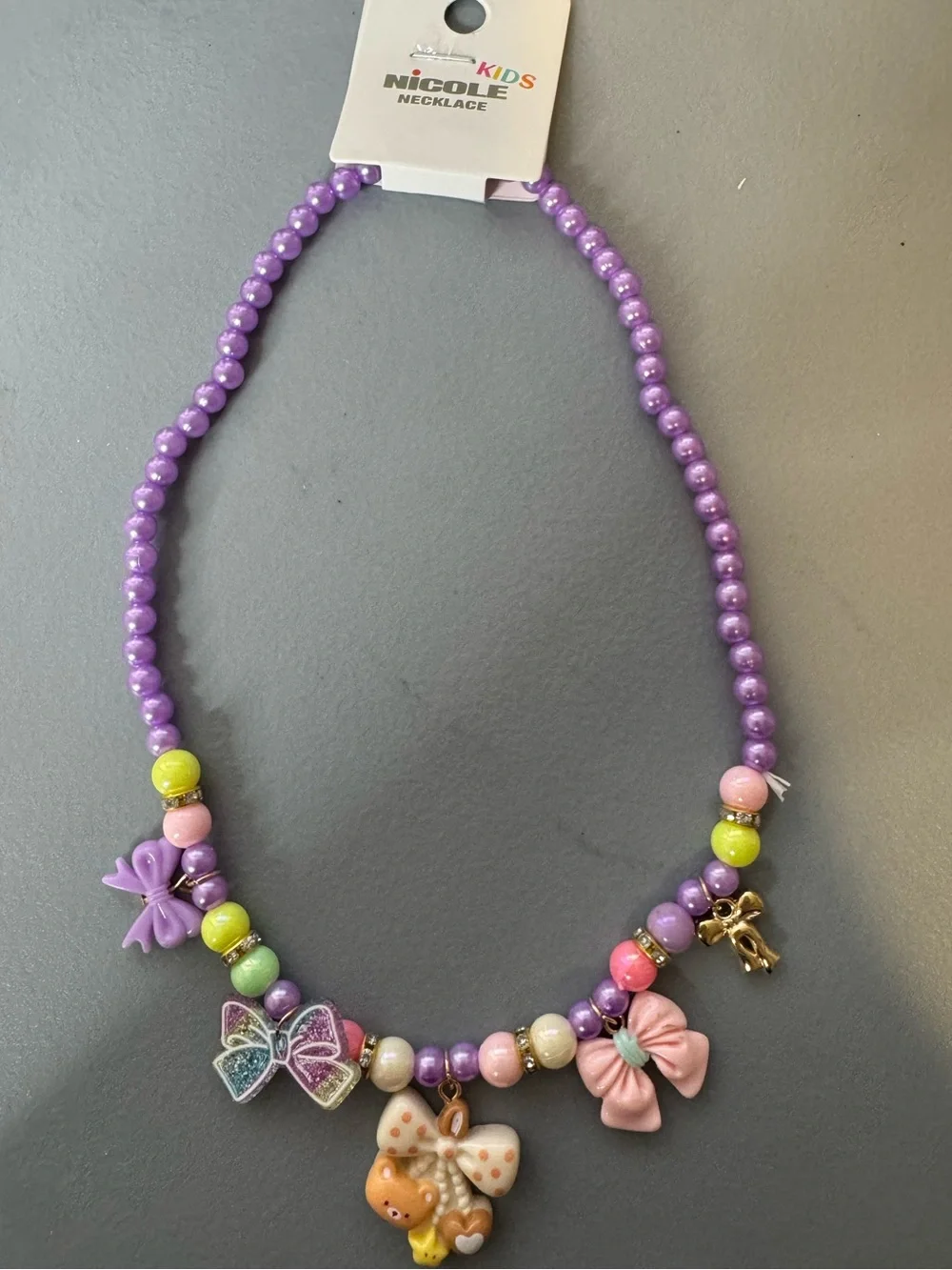 Nicole Kids Purple Beaded Charm Necklace stretch bows